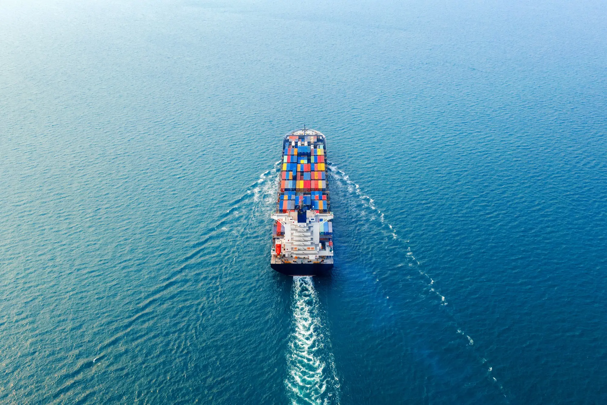 Aerial view of a container ship under way on open water